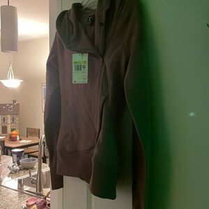 Brand new Nike women’s workout jacket in light purple, size small.